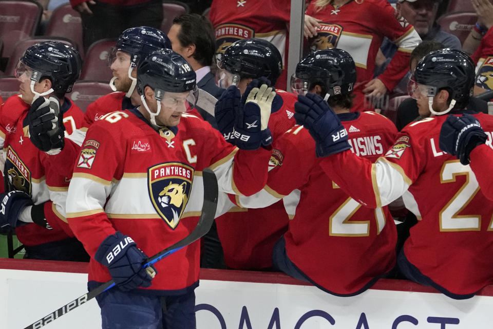 Florida Panthers center Aleksander Barkov (16) is congratulated for his goal against the Montreal Canadiens during the first period of an NHL hockey game Thursday, Feb. 29, 2024, in Sunrise, Fla. (AP Photo/Lynne Sladky)