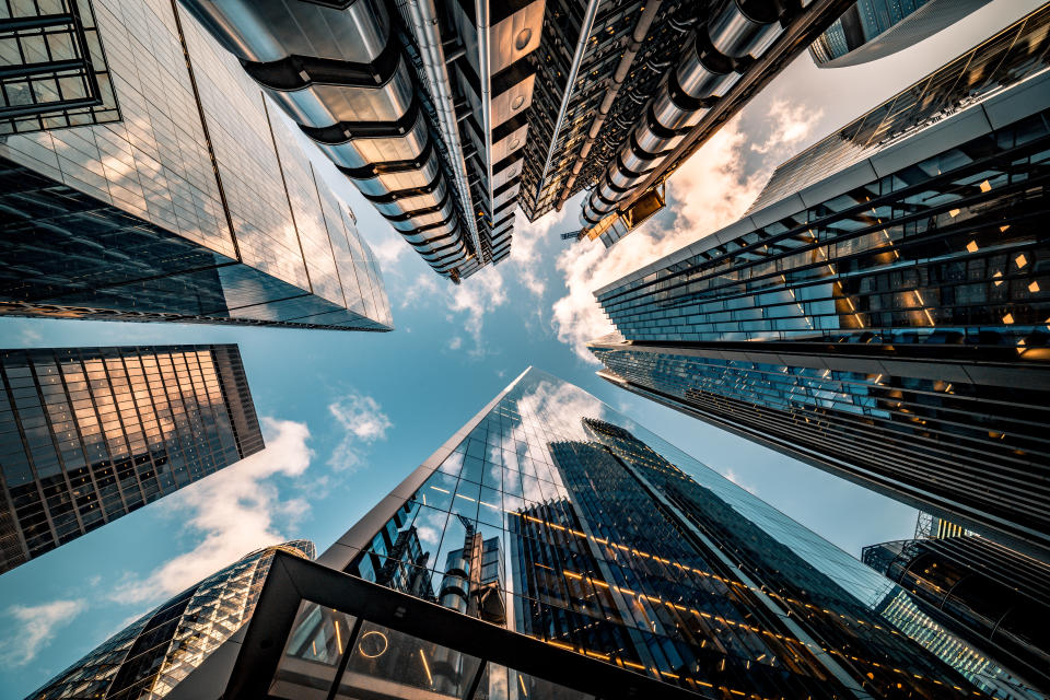 Highly detailed abstract wide angle view up towards the sky in the financial district of London City. Photo: Getty