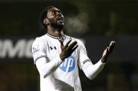 Tottenham Hotspur's Emmanuel Adebayor reacts after missing a chance to score during their English Premier League soccer match against West Bromwich Albion at White Hart Lane in London, December 26, 2013. REUTERS/Darren Staples