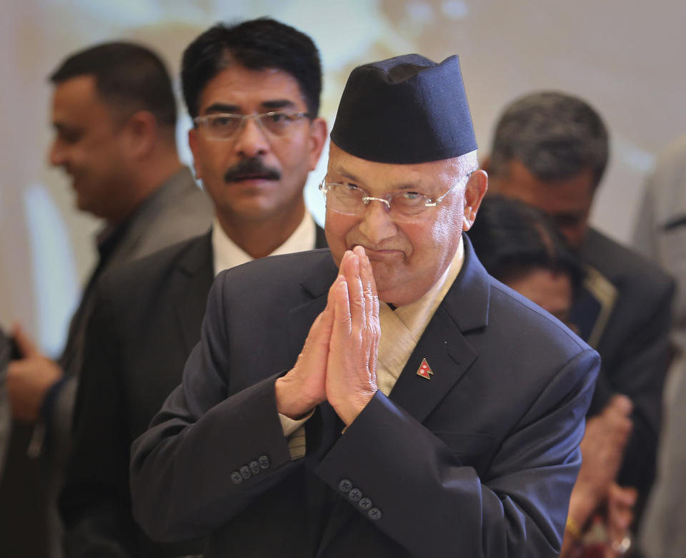 FILE- In this April 6, 2018 file photo, Nepalese Prime Minister Khadga Prasad Oli arrives for the inaugural ceremony of the India-Nepal business forum in New Delhi, India. Oli could be forced out of office within weeks amid an internal tussle for power within his governing party following his sharp rhetoric on neighboring India and as Chinese influence grows in Nepal. (AP Photo/Altaf Qadri, File)