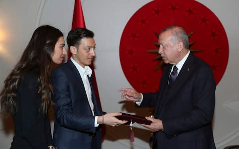 Footballer Mesut Ozil with Turkish President Recep Tayyip Erdogan - Credit: Pool Presidential Press Service