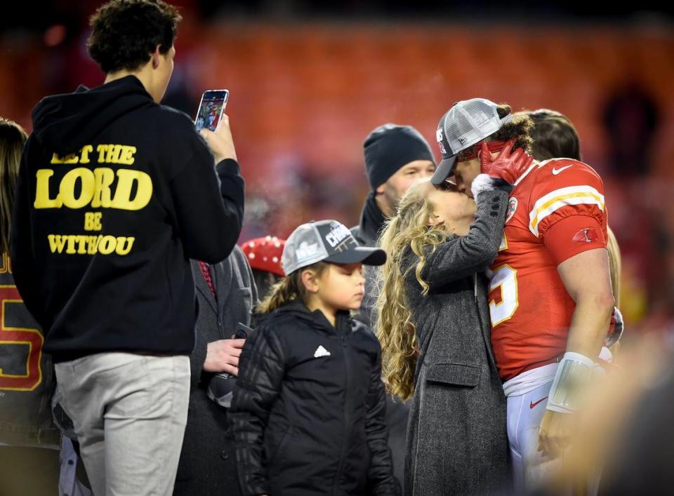 Chiefs quarterback Patrick Mahomes gets a kiss from his girlfriend, Brittany Matthews, after the his team captured the AFC Championship by defeating the Tennessee Titans, 35-24, Jan. 19 at Arrowhead Stadium.