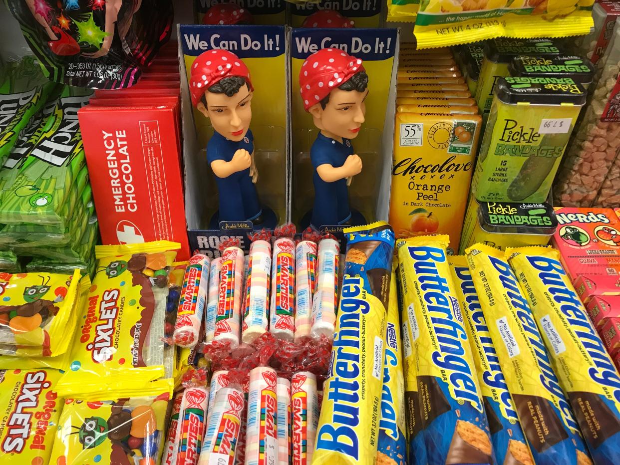 A Rosie the Riveter bobblehead sits among Smarties, Butterfinger candy bars and Pickle bandages at Rocket Fizz, when it operated in the Eastwood Towne Center. The store moved to an East Lansing storefront in February.