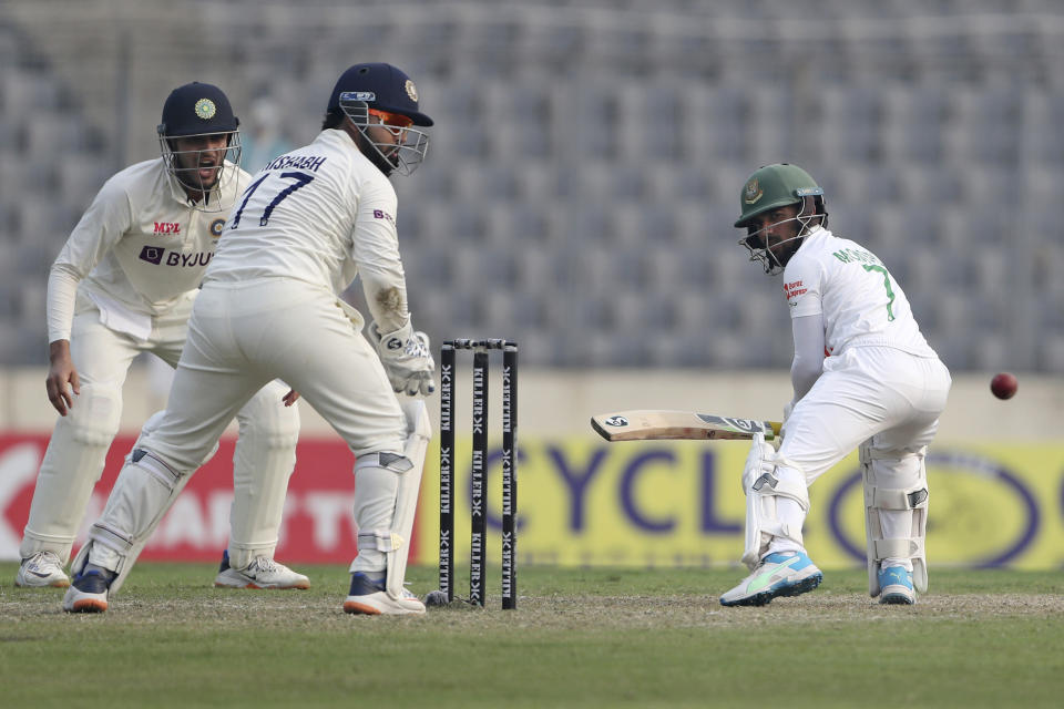 Bangladesh's Mominul Haque, right, plays a shot during the first day of the second cricket test match between Bangladesh and India, in Dhaka, Bangladesh, Thursday, Dec. 22, 2022. (AP Photo/Surjeet Yadav)