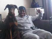 Boxer Nicola Adams' doberman, Dexter, got to watch her win the gold medal on television at home 200 miles away.