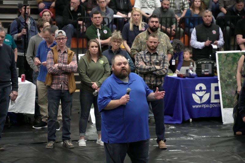 East Palestine Mayor Trent Conaway, center, leads a town hall meeting at East Palestine High School, Wednesday, Feb. 15, 2023. 