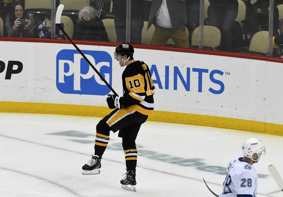 Pittsburgh Penguins left wing Drew O'Connor (10) celebrates a goal against the Tampa Bay Lightning during the first period of an NHL hockey game, Sunday, Feb. 26, 2023, in Pittsburgh. (AP Photo/Philip G. Pavely)