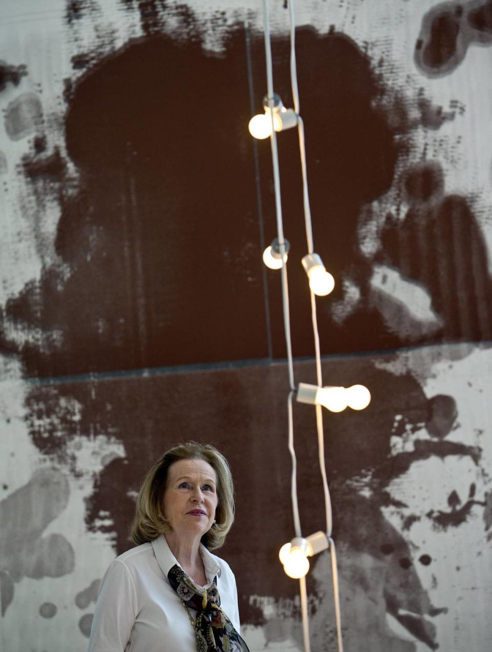 Rosa de la Cruz looks up at a work by Félix Gonzalez-Torres as she stands in front of a work by Christopher Wool at the de la Cruz Collection in the Design District on Thursday, September 22, 2016.