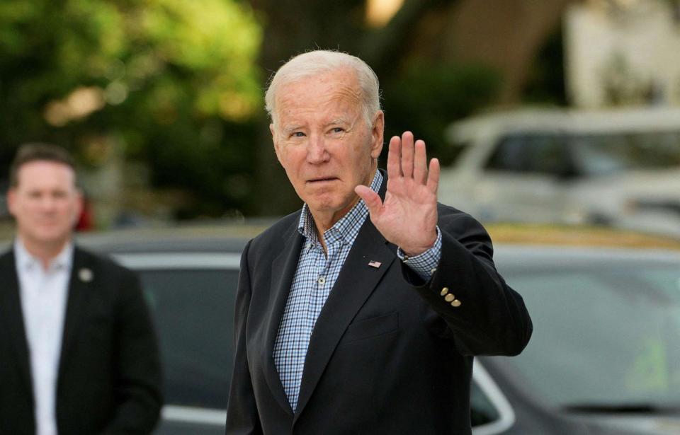 PHOTO: President Joe Biden waves as he attends church at St Edmond Catholic Church, Oct. 21, 2023, in Rehoboth Beach, Del. (Kent Nishimura/AFP via Getty Images)