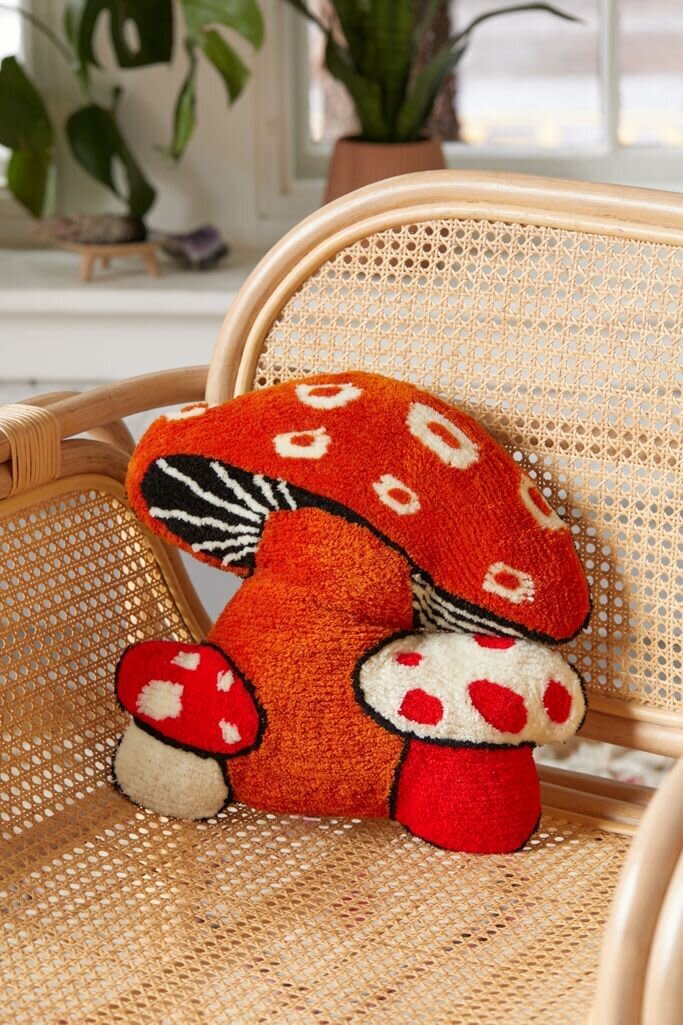 To bring the forest inside, you might just pop this kitschy mushroom-shaped pillow on an armchair. <a href="https://fave.co/3kdxDMx" target="_blank" rel="noopener noreferrer">Find it for $49 at Urban Outfitters</a>.
