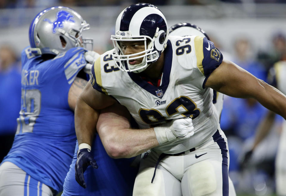 FILE - In this Dec. 2, 2018, file photo, Los Angeles Rams nose tackle Ndamukong Suh (93) rushes during the second half of an NFL football game against the Detroit Lions in Detroit. The Rams know they've got to pressure Tom Brady early and often to have a chance in the Super Bowl, and they've been assembling the tools for this job all year long. They signed Ndamukong Suh to a big free-agent deal, wrote a record-breaking contract for Aaron Donald and acquired edge rusher Dante Fowler from Jacksonville down the stretch. (AP Photo/Duane Burleson, File)
