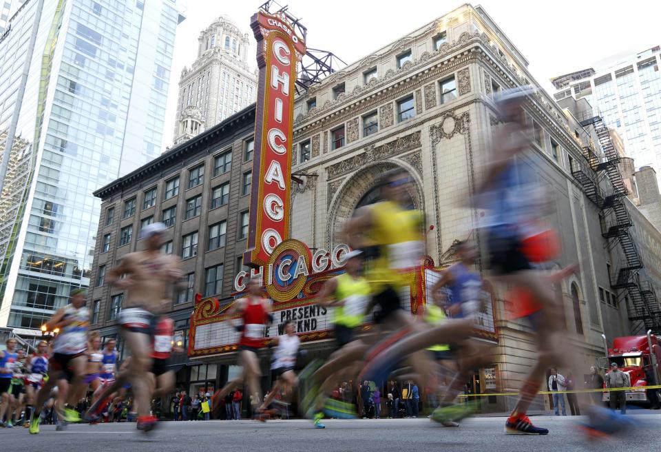 Runners participate in the Chicago Marathon through the downtown in Chicago, Illinois