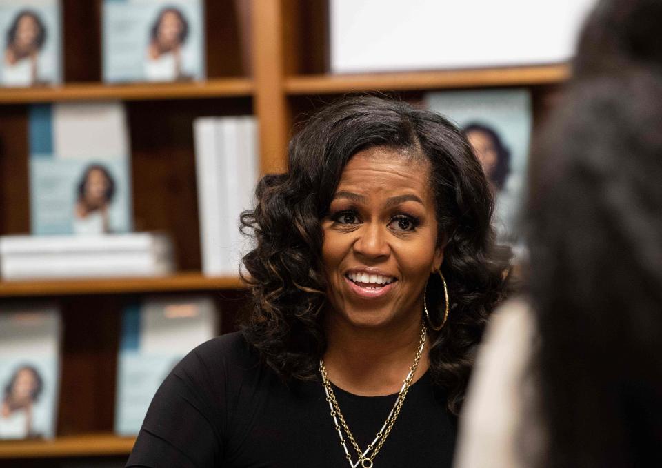 Former first lady Michelle Obama meets with fans during a book signing on the first anniversary of the launch of her memoir "Becoming" at the Politics and Prose bookstore in Washington, D.C., in 2019. Her bestseller boosted the fortunes of black-owned bookstores.