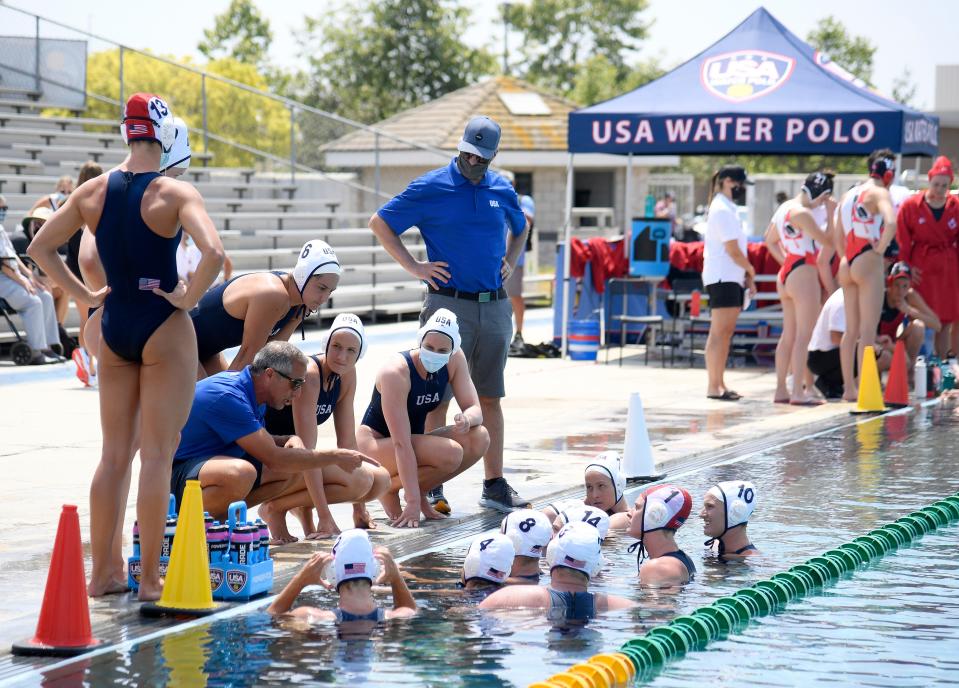 U.S. women's water polo coach Adam Krikorian speaks to his team after a timeout in a 17-5 win over Canada during an exhibition match on May 19.