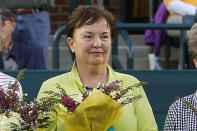 FILE - In this April 7, 2012, file photo, Kerry Melville Reid, a member of the original nine women who helped start the women's professional tennis tour, is honored at the Family Circle Cup tennis tournament in Charleston, S.C. It’s the 50th anniversary of Billie Jean King and eight other women breaking away from the tennis establishment in 1970 and signing a $1 contract to form the Virginia Slims circuit. That led to the WTA Tour, which offers millions in prize money. (AP Photo/Mic Smith, File)