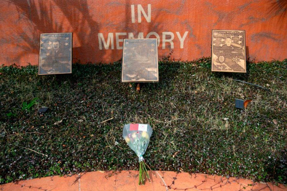 Flowers placed at a memorial to fallen police officers in Lucedale on Friday, Jan. 5, 2024, in honor of Jeremy Malone, an officer with the George County Sheriff’s Department that was killed on Thursday.