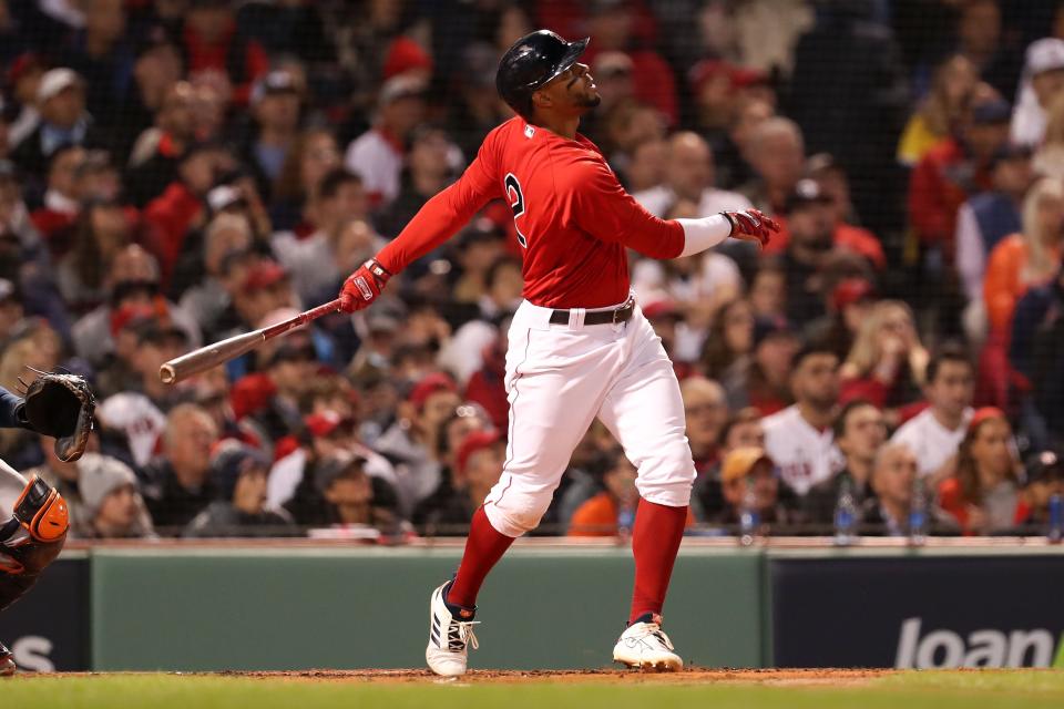 Red Sox shortstop Xander Bogaerts watches the ball after hitting a two-run home run against the Astros in the ALCS last season. Bogaerts and the Sox will open the 2022 season in New York on Friday.