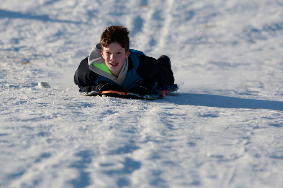 A man enjoys himself as he makes his way down Potato Hill in Westport.