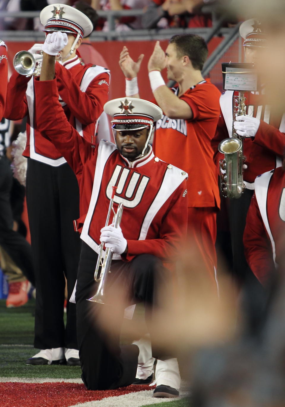 A Wisconsin Badger band member kneels during the playing of the National Anthem. Ohio State beat Wisconsin by a final score of 30-23 in overtime at Camp Randall Stadium in Madison, WI. on Oct. 15, 2016. (Photo by Patrick S Blood/Icon Sportswire via Getty Images)