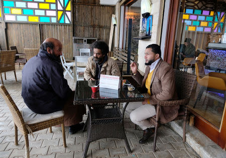 Libyan men sit in a cafe in Derna, Libya, February 9, 2019. Picture taken February 9, 2019. REUTERS/Esam Omran Al-Fetori