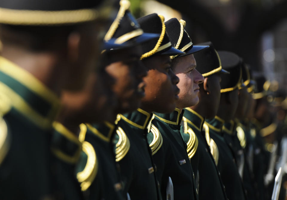 A guard of honor takes part in 20-year Democracy Anniversary celebrations at the government's Union Building in Pretoria, South Africa, Sunday, April 27, 2014. The day marks the end of the apartheid era when all races went to the polls to cast their votes in historic 1994 elections. (AP Photo)