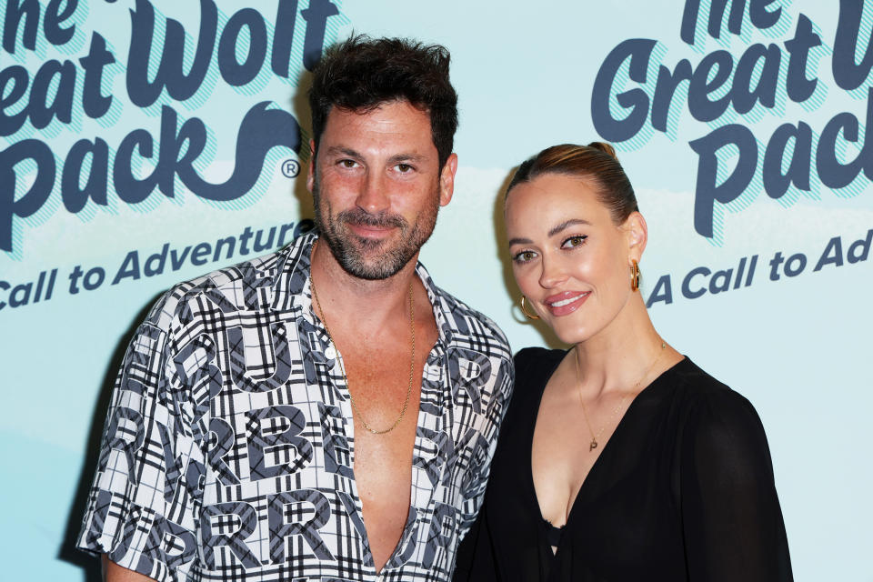 Maksim Chmerkovskiy (L) and Peta Murgatroyd attend Great Wolf Lodge's “The Great Wolf Pack: A Call to Adventure” red carpet event at Great Wolf Lodge on August 23, 2022 in Garden Grove, California.  (Phillip Faraone / Getty Images)