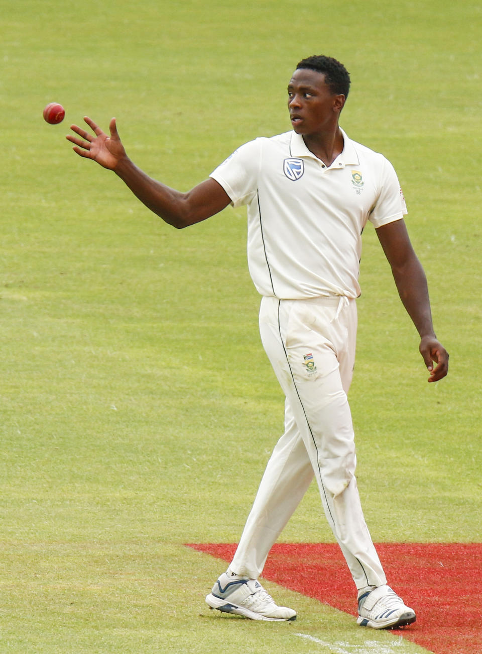South Africa's Kagiso Rabada, takes the ball to bowl during their third day of the second cricket test at St. George's Park in Port Elizabeth, South Africa between South Africa and Sri Lanka Saturday, Feb. 23, 2019. (AP Photo/Michael Sheehan)
