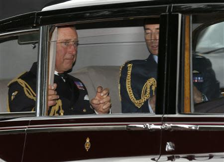 Britain's Prince Charles (L) arrives for the christening of Prince George at St James's Palace in London October 23, 2013. REUTERS/Olivia Harris
