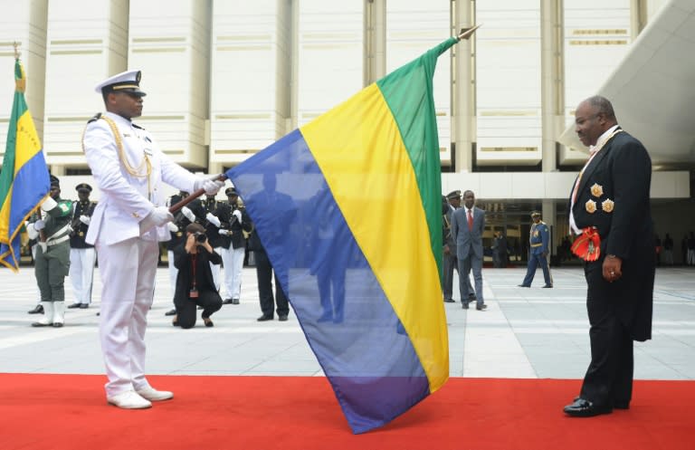 Gabon President elected Ali Bongo Ondimba to the flag during the swearing in ceremony in Libreville on September 27, 2016