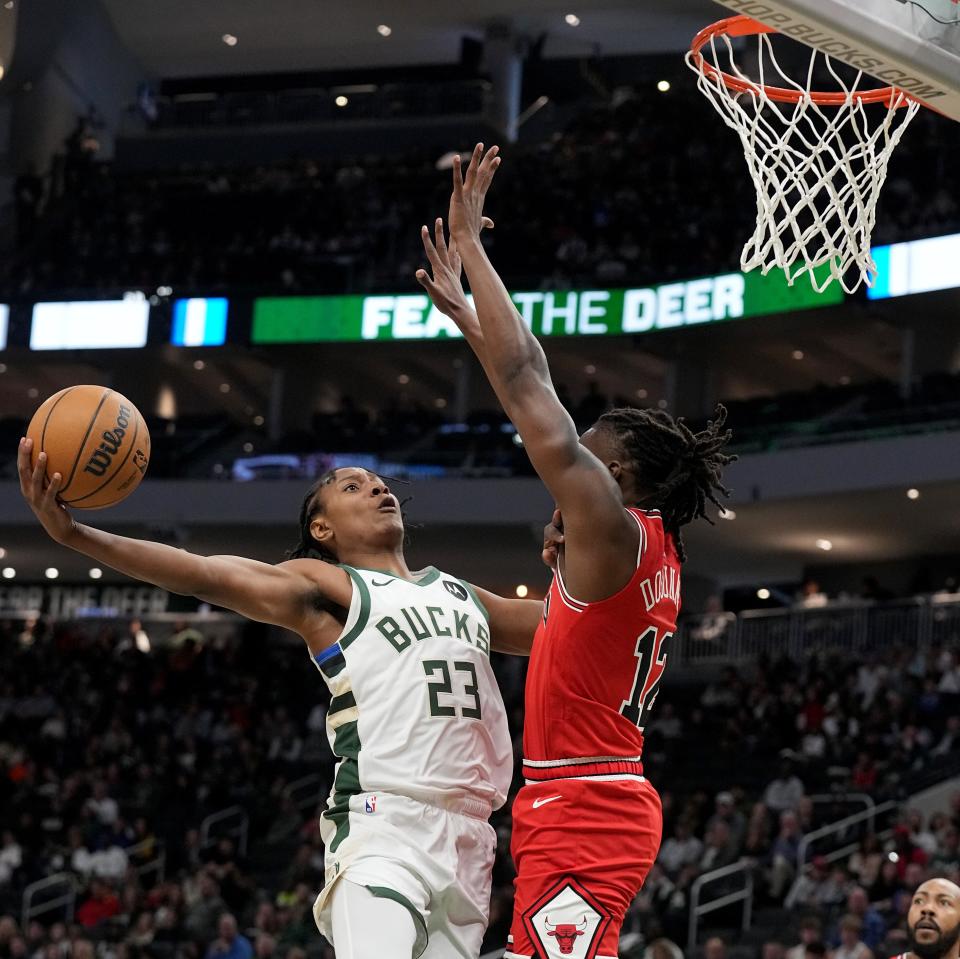 Milwaukee Bucks guard TyTy Washington Jr. (23) scores on Chicago Bulls guard Ayo Dosunmu (12) during the first half of their preseason game Sunday, October 8, 2023 at Fiserv Forum in Milwaukee, Wisconsin.