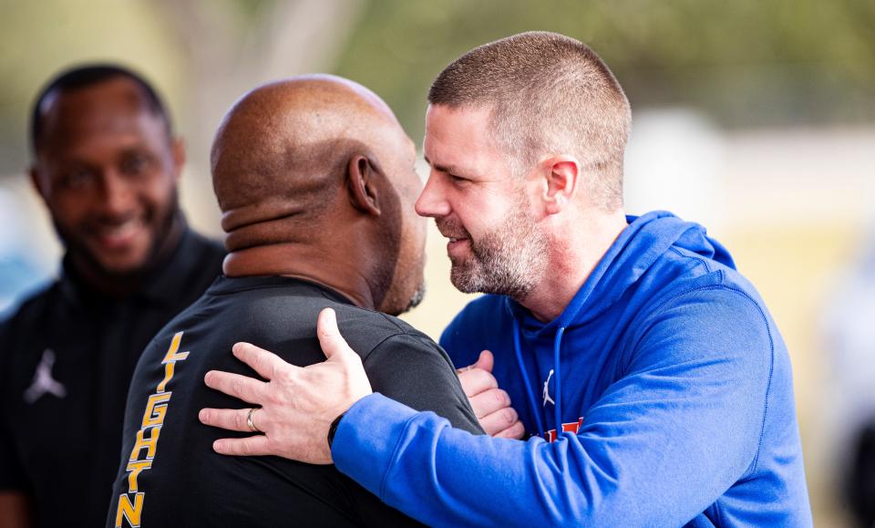 New Florida head football coach Billy Napier, right,  greets Lehigh coach James Chaney on Thursday. He met with coaches and staff to talk about Richard Young. Young is a top football recruit.