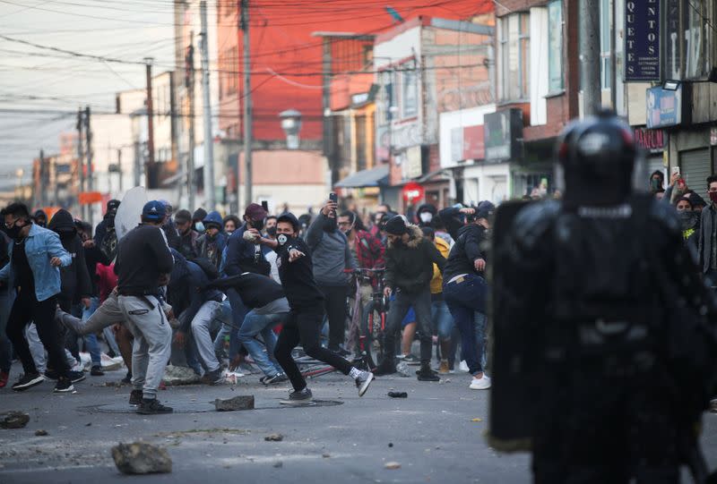 Protesters clash with police after a man, who was detained for violating social distancing rules, died from being repeatedly shocked with a stun gun by officers, according to authorities, in Bogota