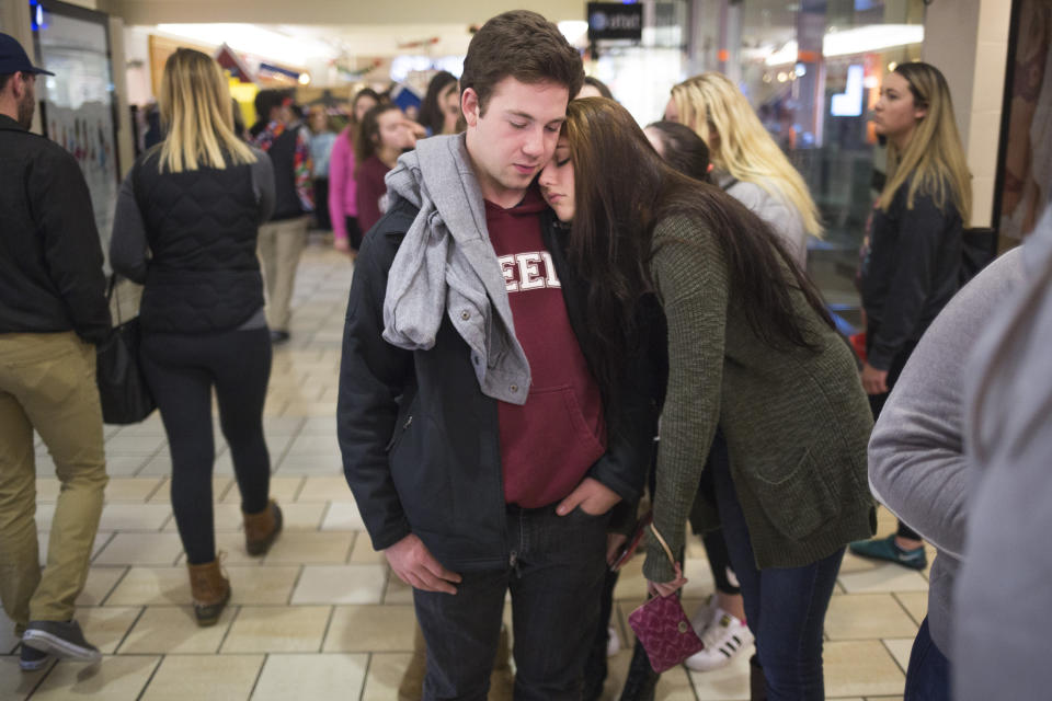SOUTH PORTLAND, ME – NOVEMBER 25 2016: Max Richardson, 17, of Cumberland, and Trinity Turcotte, 16, of Brunswick, wait in line to get into the store Victoria’s Secret’s Pink store just after midnight during Black Friday at the Maine Mall. (Brianna Soukup/Getty Images)