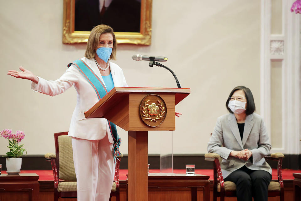 In this photo released by the Taiwan Presidential Office, U.S. House Speaker Nancy Pelosi speaks during a meeting with Taiwanese President President Tsai Ing-wen, right, in Taipei, Taiwan, Wednesday, Aug. 3, 2022. U.S. House Speaker Nancy Pelosi, meeting top officials in Taiwan despite warnings from China, said Wednesday that she and other congressional leaders in a visiting delegation are showing they will not abandon their commitment to the self-governing island. (Taiwan Presidential Office via AP)