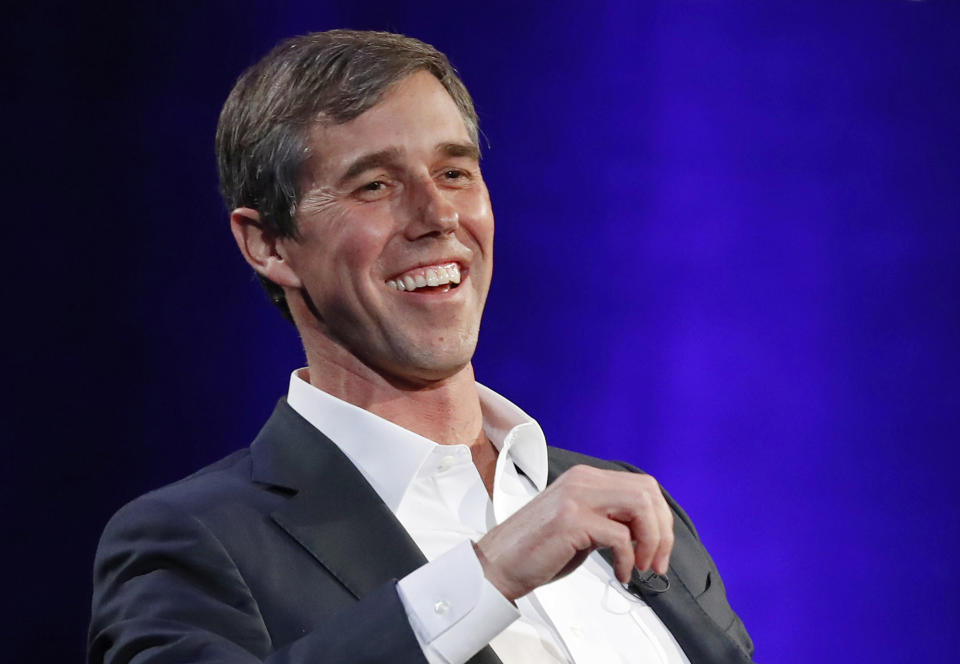 FILE - In this Tuesday, Feb. 5, 2019 file photo, former Democratic Texas congressman Beto O'Rourke laughs during a live interview with Oprah Winfrey on a Times Square stage at "SuperSoul Conversations," in New York. O'Rourke formally announced Thursday that he'll seek the 2020 Democratic presidential nomination, ending months of intense speculation over whether he'd try to translate his newfound political celebrity into a White House bid. (AP Photo/Kathy Willens, File)