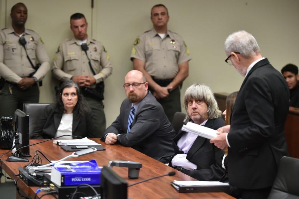 Louise and David Turpin (seated, first and third from left) in court in California following their arrests