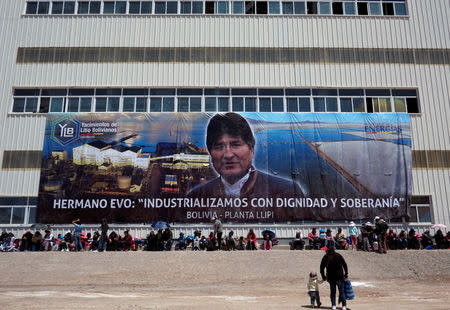 A banner with the image of Bolivia's President Evo Moraes and the slogan "Brother Evo, we industrialize with dignity and sovereignty", is seen at a potassium chloride plant in Llipi, on the salt flats of Uyuni, Bolivia, October 7, 2018. REUTERS/David Mercado