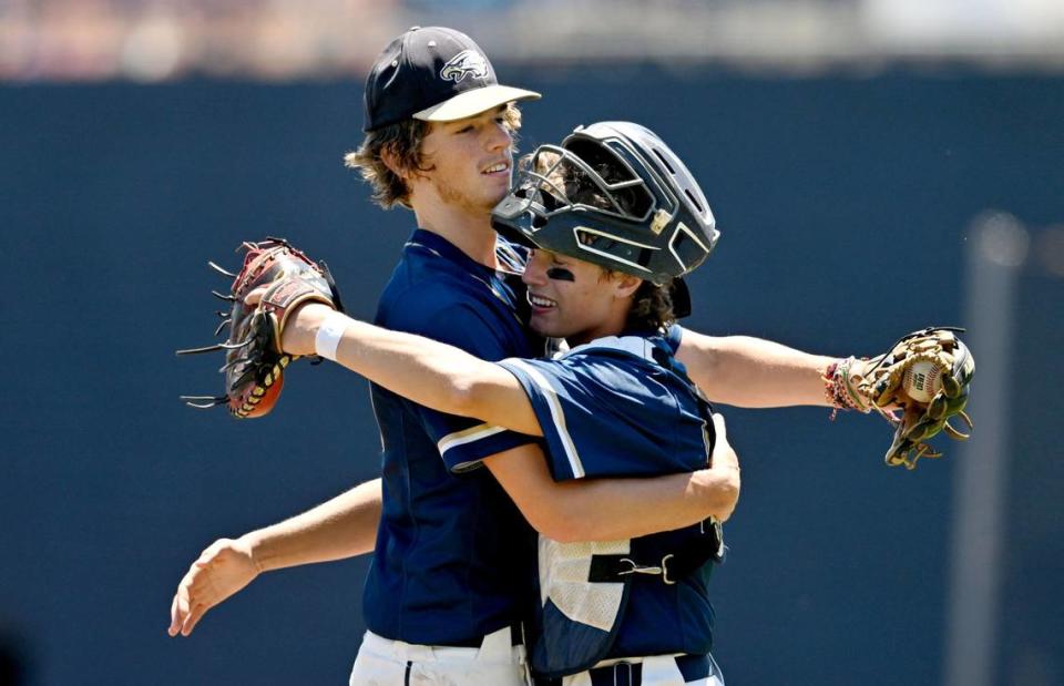 Bald Eagle Area’s Weston McClain hugs catcher Kaden Burns as he leaves the game due to the pitch count in the 7th inning of the PIAA 2A championship game against Tri-Valley at Medlar Field on Thursday, June 13, 2024.