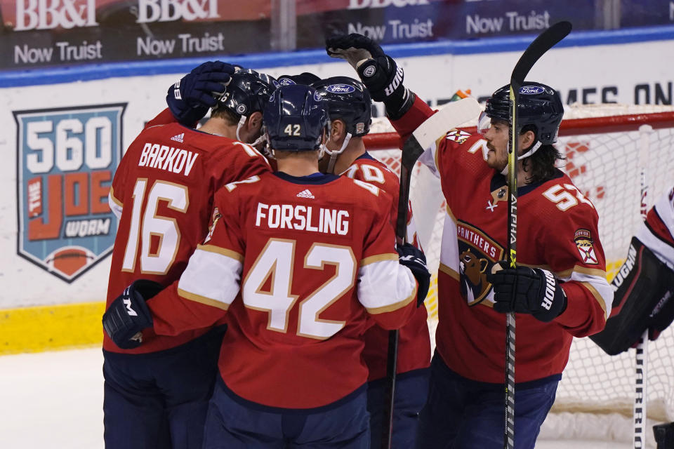 Florida Panthers celebrate a goal by center Aleksander Barkov (16) during the first period of an NHL hockey game against the Carolina Hurricanes, Thursday, April 22, 2021, in Sunrise, Fla. (AP Photo/Marta Lavandier)