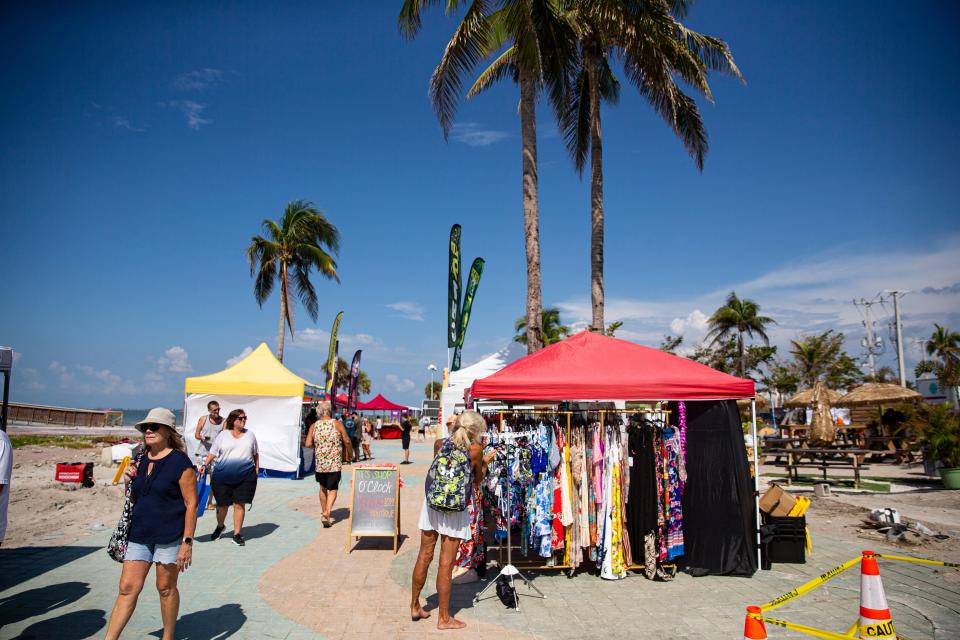 Patrons peruse the Farmers Market at Times Square on Fort Myers Beach on Friday, Sept. 8, 2023. The market recently opened on FridayÕs at the location which was decimated in Hurricane Ian.