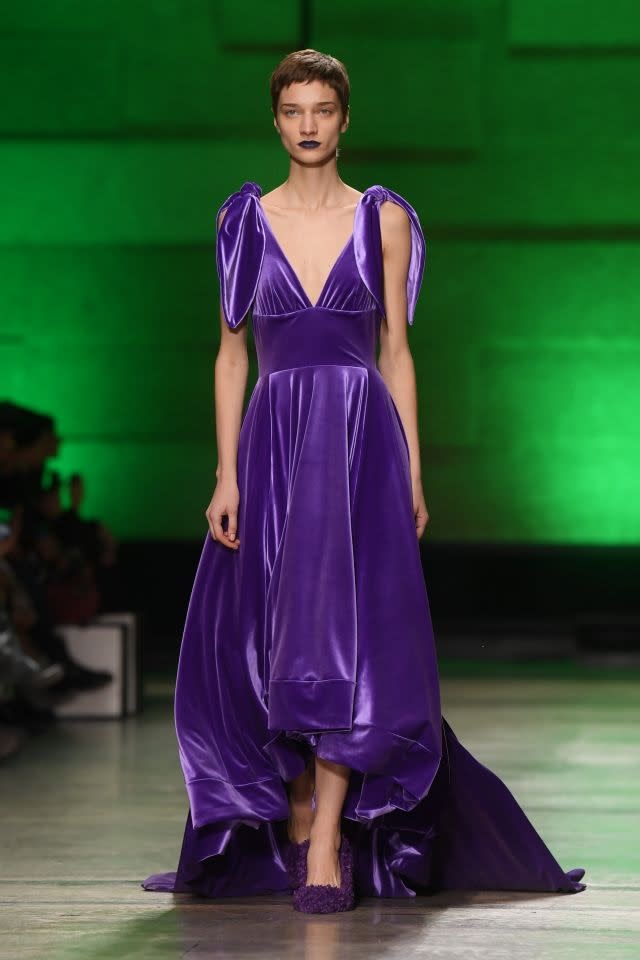 This velvet-effect ball gown by Annakiki is fit for a princess with its compact train. Milan, February 21, 2018