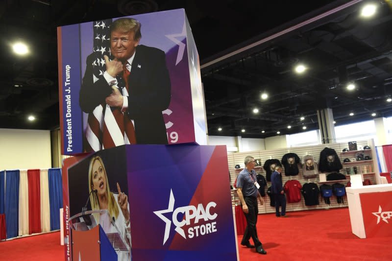 A photo from a previous conference shows former President Donald Trump hugging the U.S. flag at the Conservative Political Action Conference on Thursday in National Harbor, M. Photo by Mike Theiler/UPI