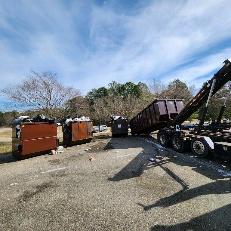 Roll off dumpsters are placed near full dumpsters on Fort Liberty in late February, while officials work to reduce overflowing trash issues across post.