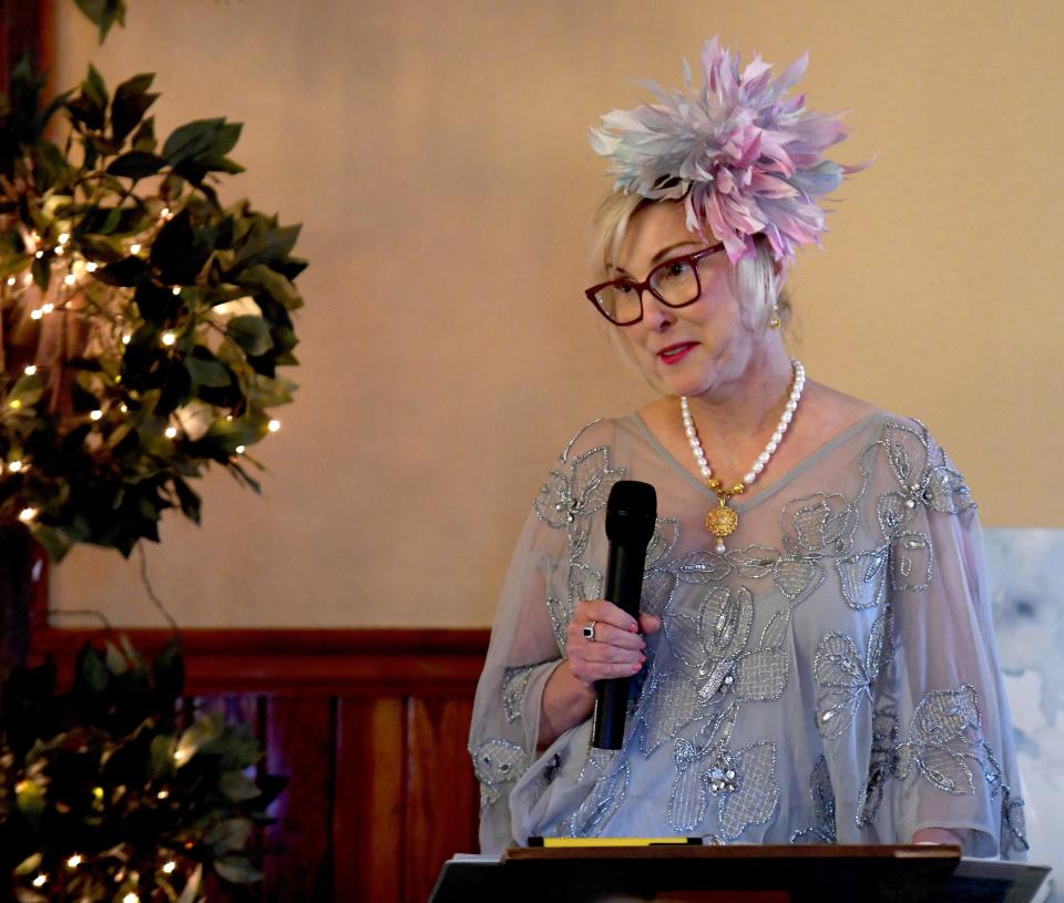 Jill Hutsell emcees the Massillon Woman&#39;s Club Daffodil Luncheon 2022 Floral Fantasy - The Language of Flowers. The fashion show focused on how flowers represented different emotions during Victorian times.