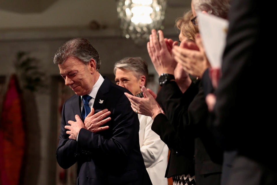 Nobel Peace Prize laureate Juan Manuel Santos reacts