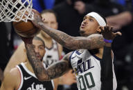 Utah Jazz guard Jordan Clarkson, right, shoots as Los Angeles Clippers forward Nicolas Batum, left, watches during the first half in Game 6 of a second-round NBA basketball playoff series Friday, June 18, 2021, in Los Angeles. (AP Photo/Mark J. Terrill)