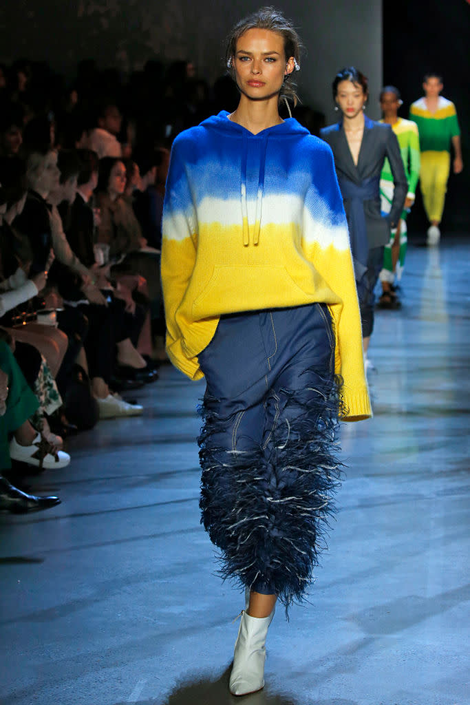 <p>A model walks Prabal Gurung’s Spring 2019 show wearing a blue, yellow, and white tie-dye hoodie. (Photo: Getty Images) </p>