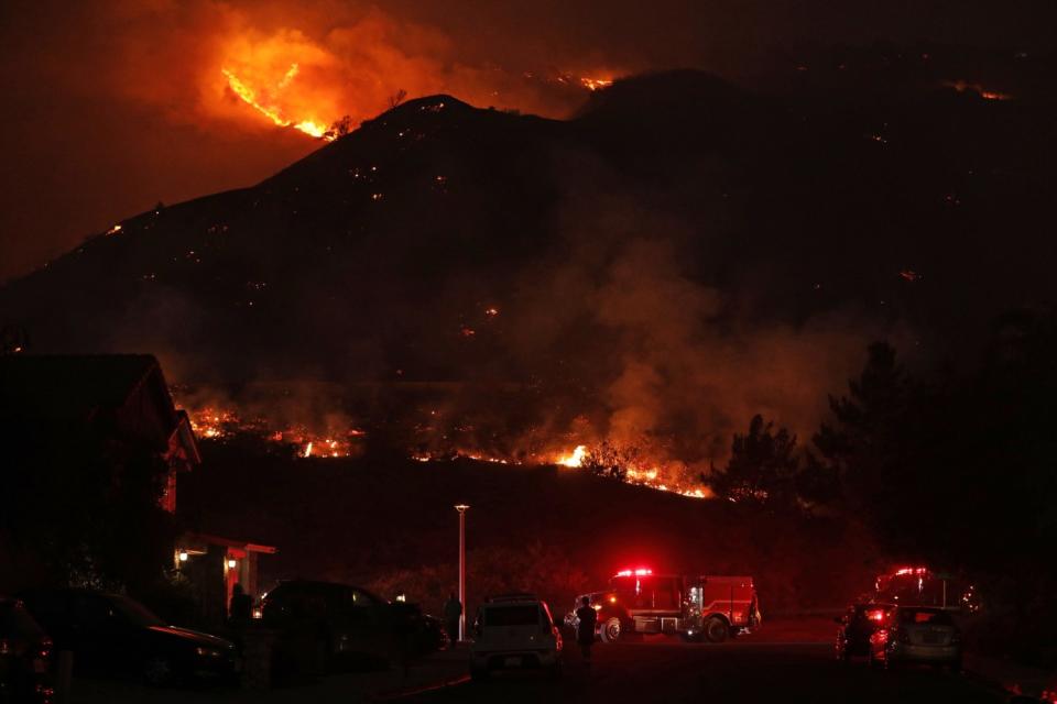 The hillside burns near Foxtail Drive and Lotus Avenue in Yorba Linda.