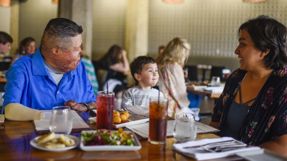 Marine Corps veteran Anthony Villarreal, who helps run several Wounded Warrior Project events, shares a meal with his wife and son in Texas in June 2018. (WWP photo)