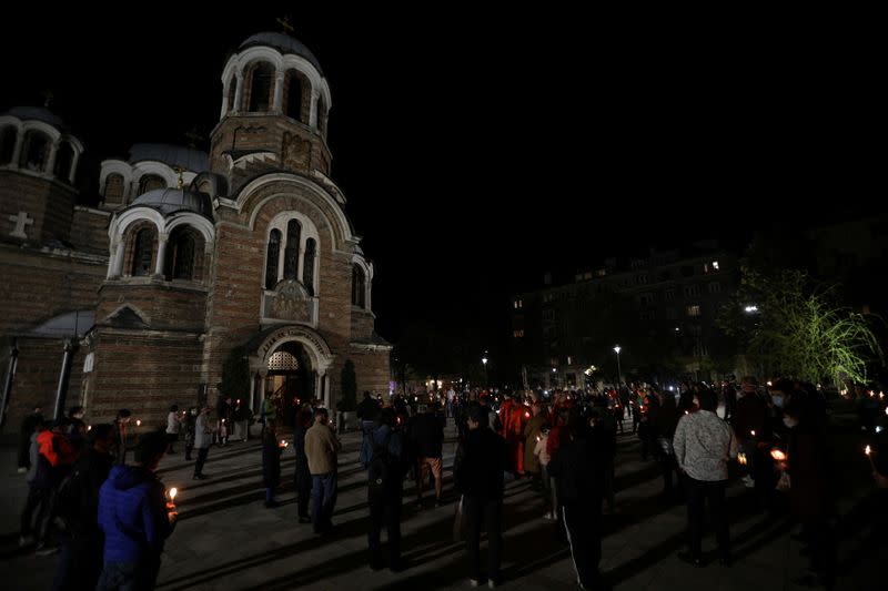 People attend Orthodox Easter service outside Sveti Sedmochislenitsi church in Sofia
